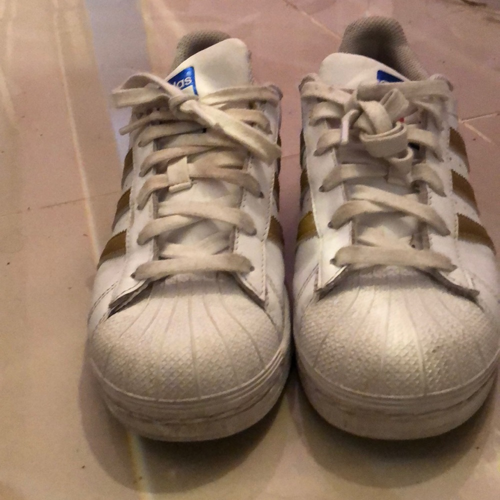 gold and white adidas